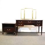 Modern mahogany effect dressing table, gilt triptych mirror and a bedside table,