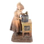 Large Austrian terracotta model of a girl at a stove, early 20th century