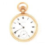 A gold-plated open face pocket watch.