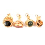 Four modern 9 carat gold stone set seals/fobs.