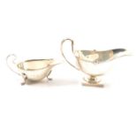 Two silver sauce boats.