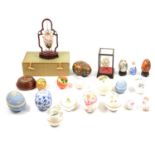 Collection of glass, ceramic and wooden egg ornaments and trinket boxes.