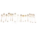 Set of six Victorian silver tablespoons and sugar nips, Charles Edwards, London 1889, and flatware.