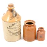 Collection of stoneware flagon, smaller bottles and whisky.