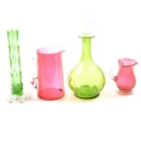 Collection of cranberry glass and green glass decanters and stemware