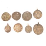 Eight hammered coins, possibly Ancient Greece, Sasanian Empire, and Parthian Empire.