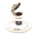 A silver capstan inkwell, Lionel Smith & Co,