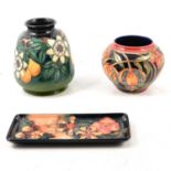 Moorcroft Pottery - two vases and a tray, plus The Phoenix Years book