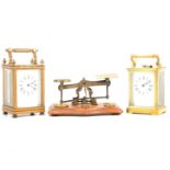 Two brass cased carriage clocks and a set of postal scales