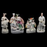 Five Staffordshire pottery flatback figurines and a pair of King Charles spaniels