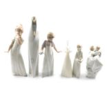 A collection of Lladro, Nao and Doulton figurines.