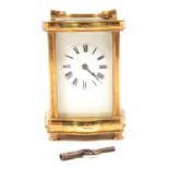 French brass carriage clock, serpentine case