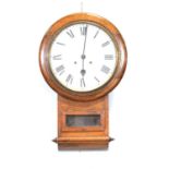 An oak cased wall clock.