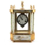 Continental four-glass mantel clock.