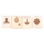 Approx. 90 military cap badges, lapel badges and buttons.