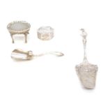 A silver miniature table, small white metal pill box, small slice and sugar scoop.