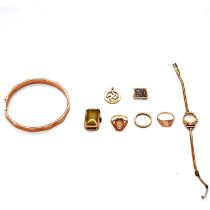 A 9 carat gold slave bangle, watch, rings, pendant.