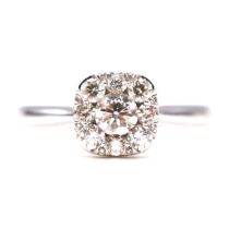 A diamond halo square cluster ring