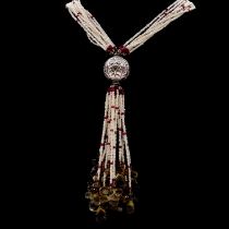 A seed pearl, ruby and quartz tassel necklace.