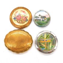 Fifty-five vintage compacts.
