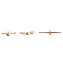 Three gemset bar brooches.