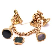 A gold charm bracelet with six seals.