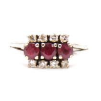 A ruby and diamond triple row ring.