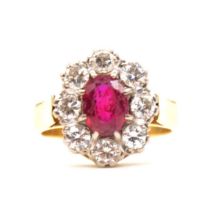 CATALOGUE AMENDMENT - A ruby (synthetic ruby) and diamond cluster ring.