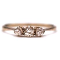 A diamond three stone ring and seven loose diamonds.