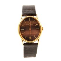Baume & Mercier- a Baumatic gentleman's 18 carat gold wristwatch.