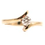 A diamond solitaire ring.