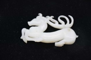 A late Qing dynasty Hetian white jade horse pendant.