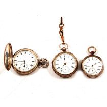 A silver full hunter pocket watch and two silver / white metal open face pocket watches.
