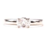 A diamond solitaire ring.