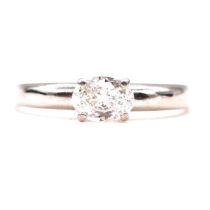 A diamond solitaire ring.