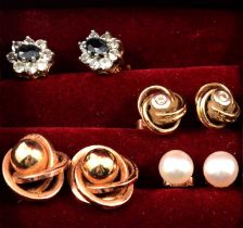 Four pairs of earrings for pierced ears in a Jacob jewel box.
