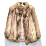 A short fox fur jacket by Alma Furs of Wimbledon.