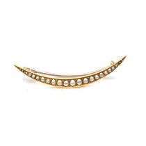 A seed pearl open crescent brooch.