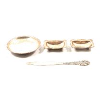Omar Ramsden silver letter knife, circular dish and a pair of salts,