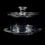 A plain circular butter dish and stand