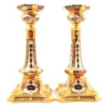 Pair of Royal Crown Derby bone china silver shaped candlesticks,