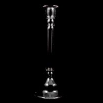 A slender hollow-stem candlestick