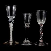 Two wine glasses and a cordial glass