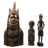 Collection of carved African and tribal figures, plaques, and wall masks