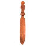 Treen; carved softwood and nut page turner,