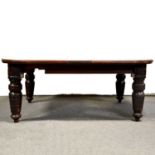 Edwardian oak extending dining table and six matched dining chairs,