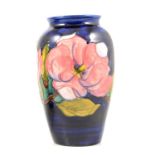 Moorcroft Pottery, a 'Magnolia' design baluster vase.