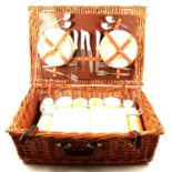 A vintage fitted cane picnic basket and embossed leather stick stand.