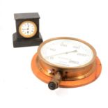 Wall-mounted brass case pressure gauge and a Victorian black slate mantel clock