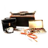 Vintage leather Doctors bag and other medical equipment.